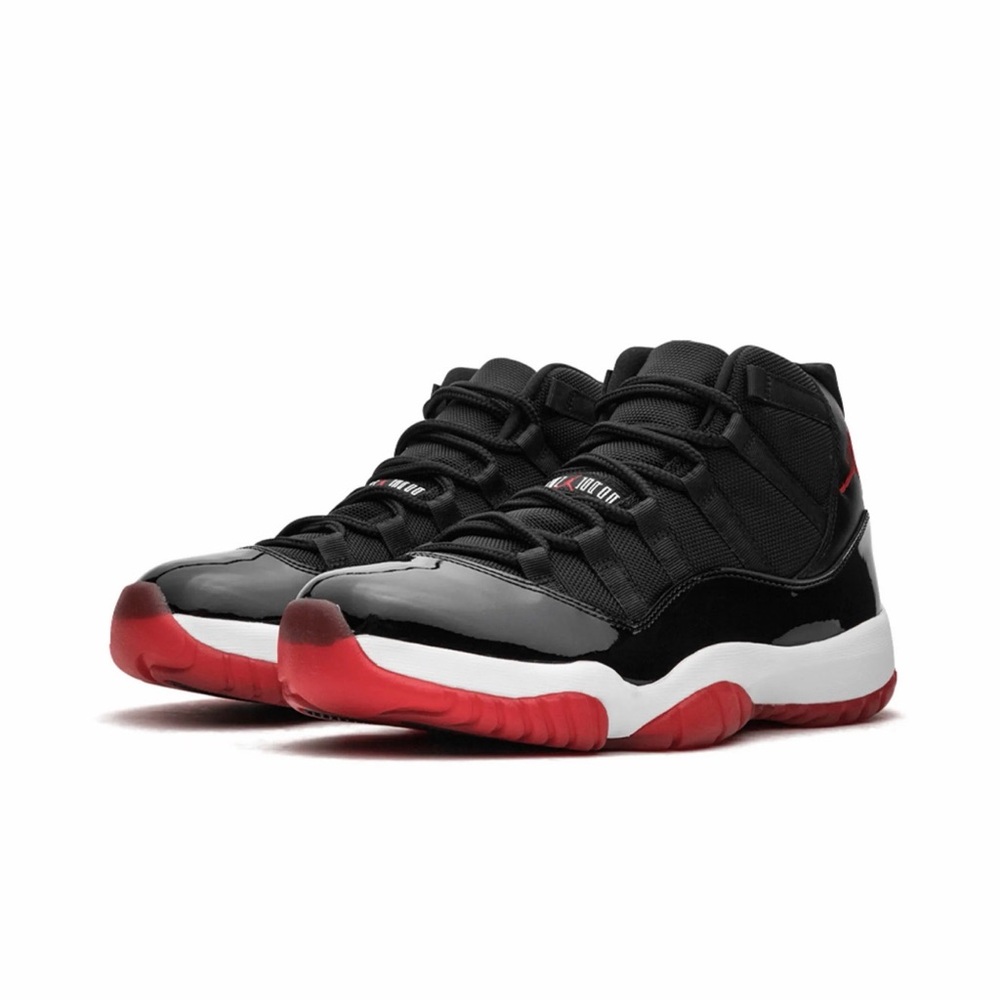 Jordan 11 Retro "Playoffs Bred" sneaker. Unisex